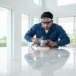 Professional technician polishing marble surface in a Miami home